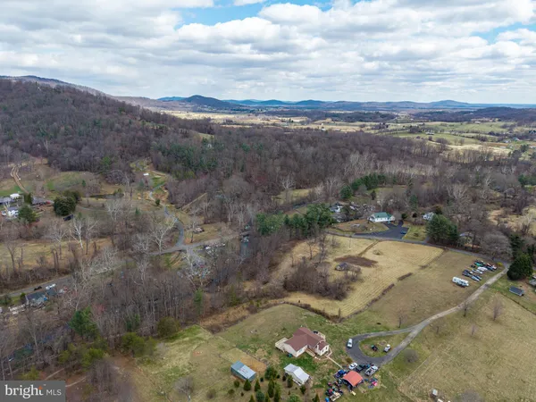 a view of a street with a yard