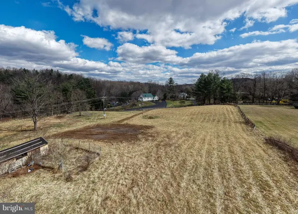 a view of a lake with houses in the background