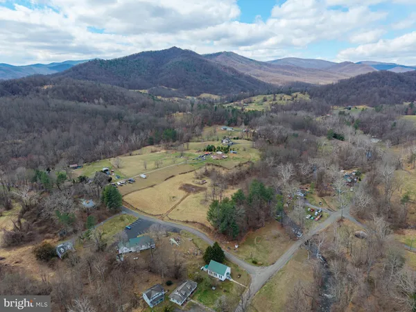a view of a street with mountains in the background