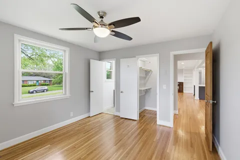 a view of livingroom with hardwood floor and a ceiling fan
