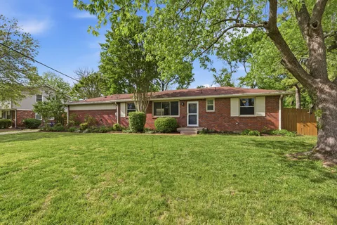 a view of a house with a back yard