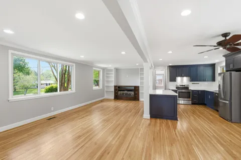 a view of kitchen with wooden floor and window
