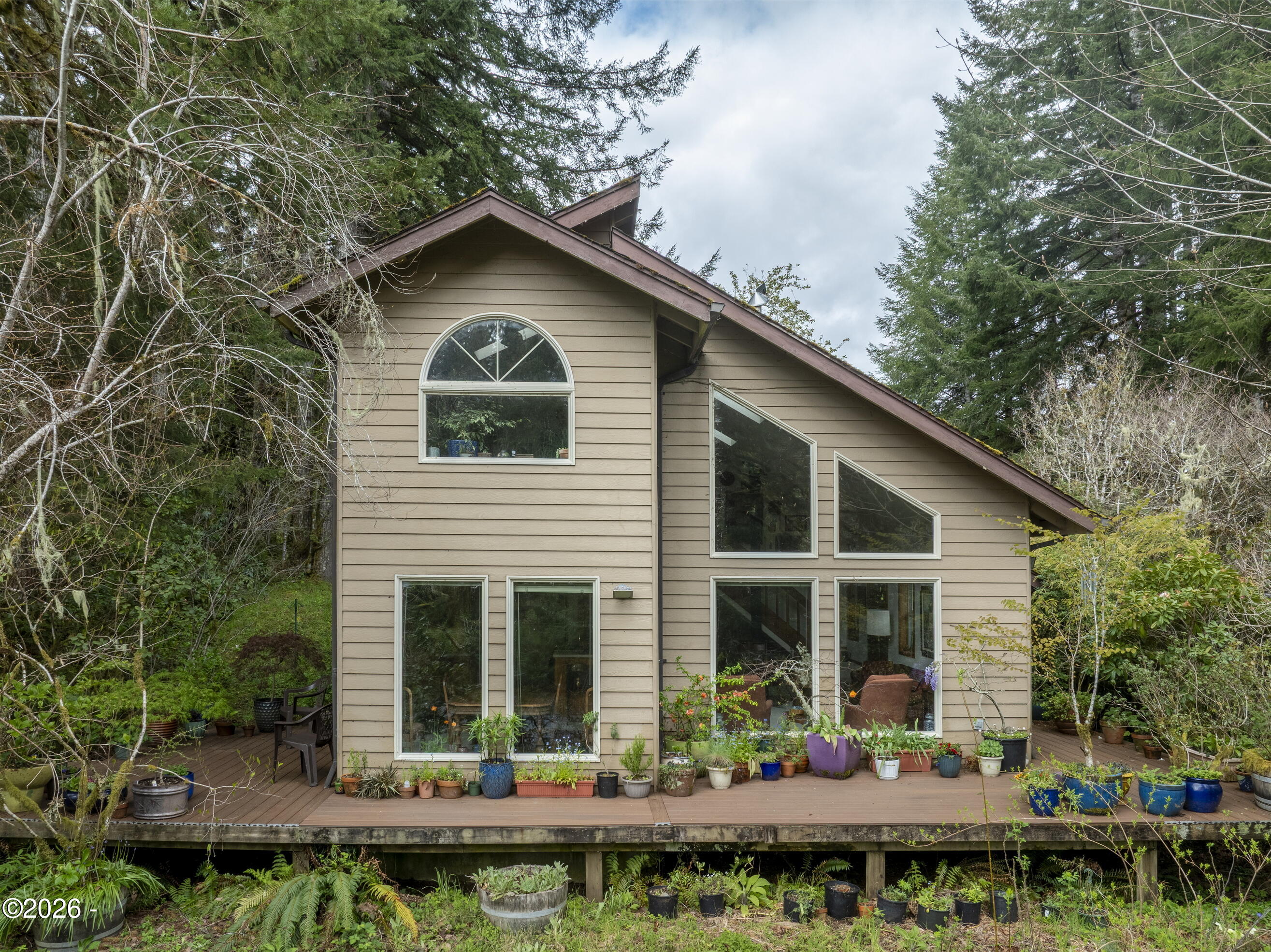 4110 Logsden Road Siletz, OR 97380 - Photo 1 of 52 River side of home