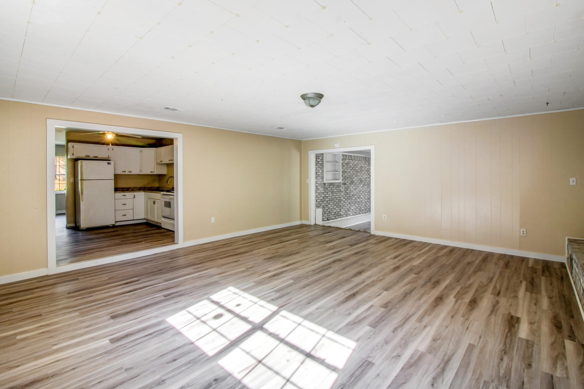 697 Long Drive Crestview, FL 32539 - Photo 12 of 26 a view of empty room with wooden floor