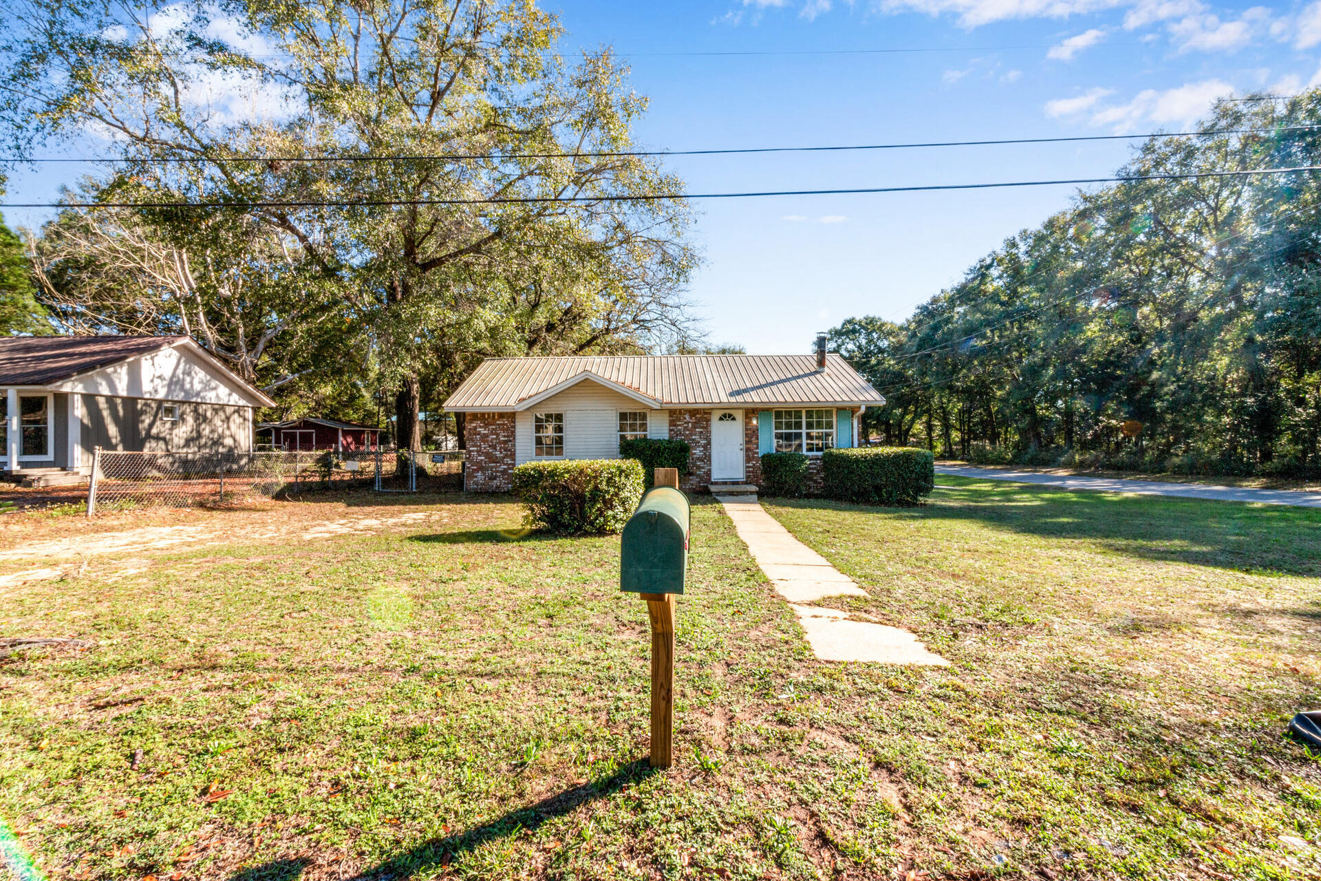 697 Long Drive Crestview, FL 32539 - Photo 2 of 26 a front view of a house with swimming pool