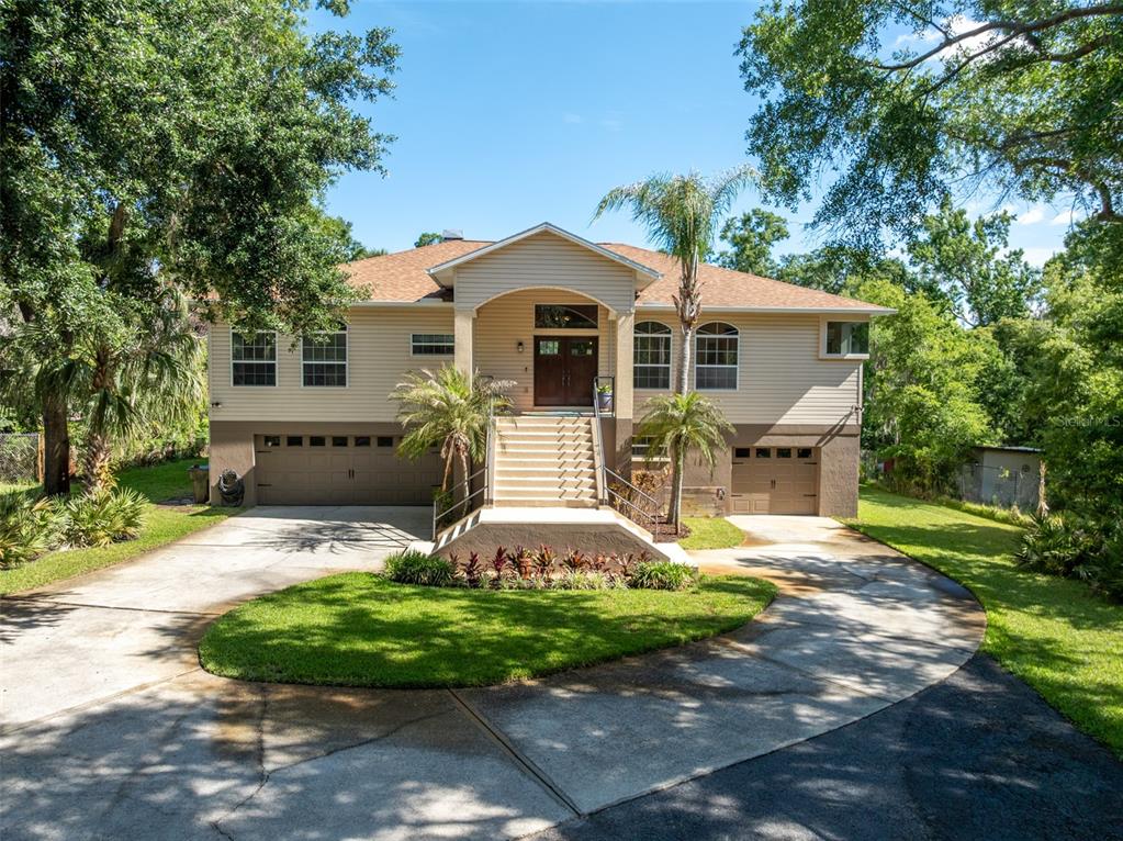 8214 Revels Road Riverview, FL 33569 - Photo 1 of 86 a front view of a house with a yard and garage