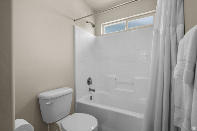 955 Delorean Lane Midvale, UT 84047 - Photo 32 of 47 Bathroom featuring a white bathtub, white subway tile surround, and a chrome shower fixture