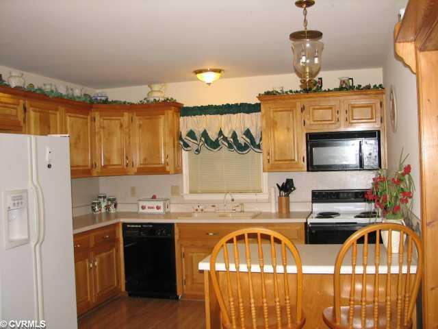 2108 Old Bermuda Hundred Road Chester, VA 23836 - Photo 2 of 4 Kitchen - Eat-in kitchen with peninsula and 2 sets of bi-fold doors for W/D and pantry