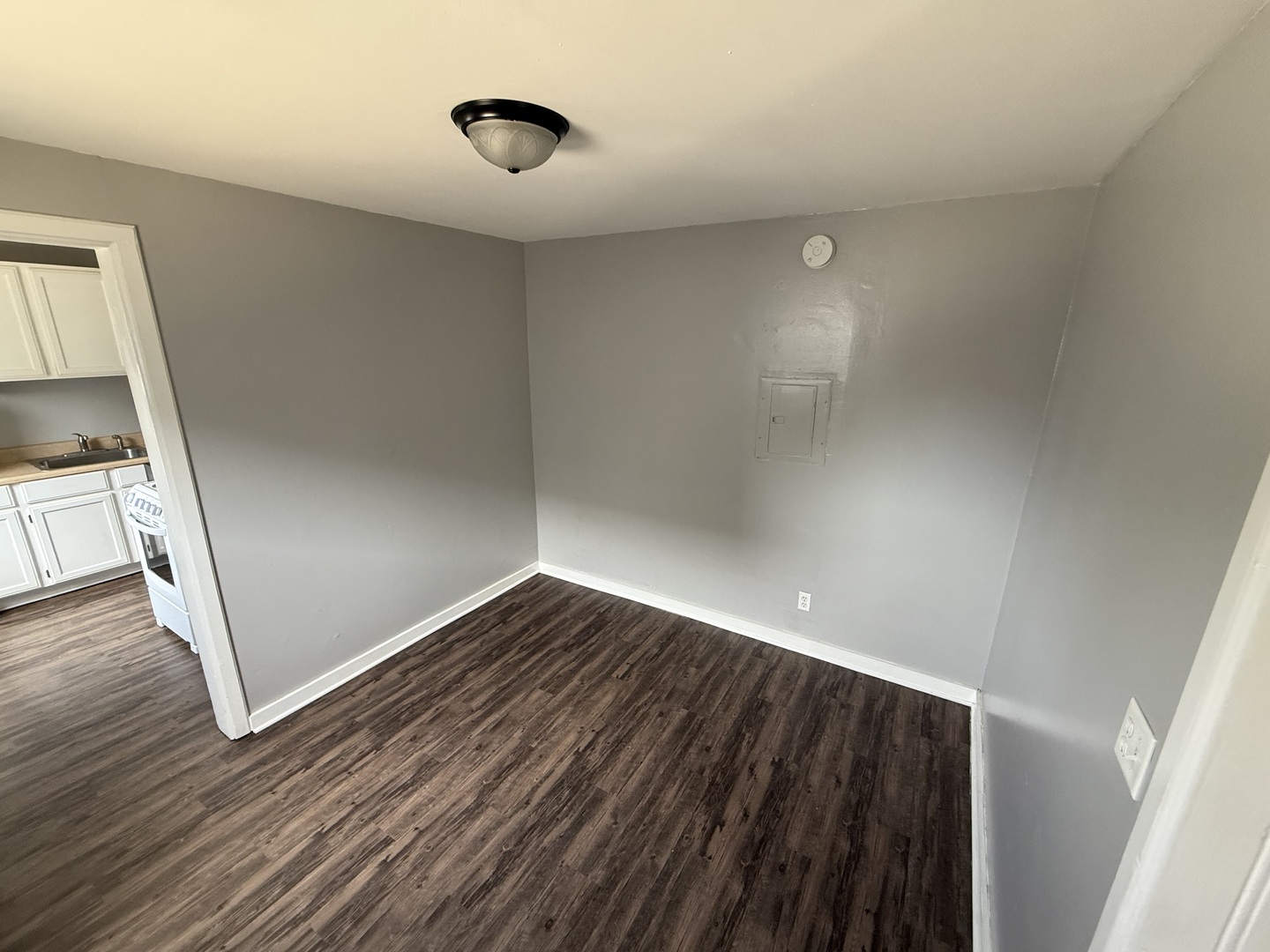 86 North 4th Street, Unit 2 Aurora, IL 60505 - Photo 5 of 6 a view of empty room with wooden floor