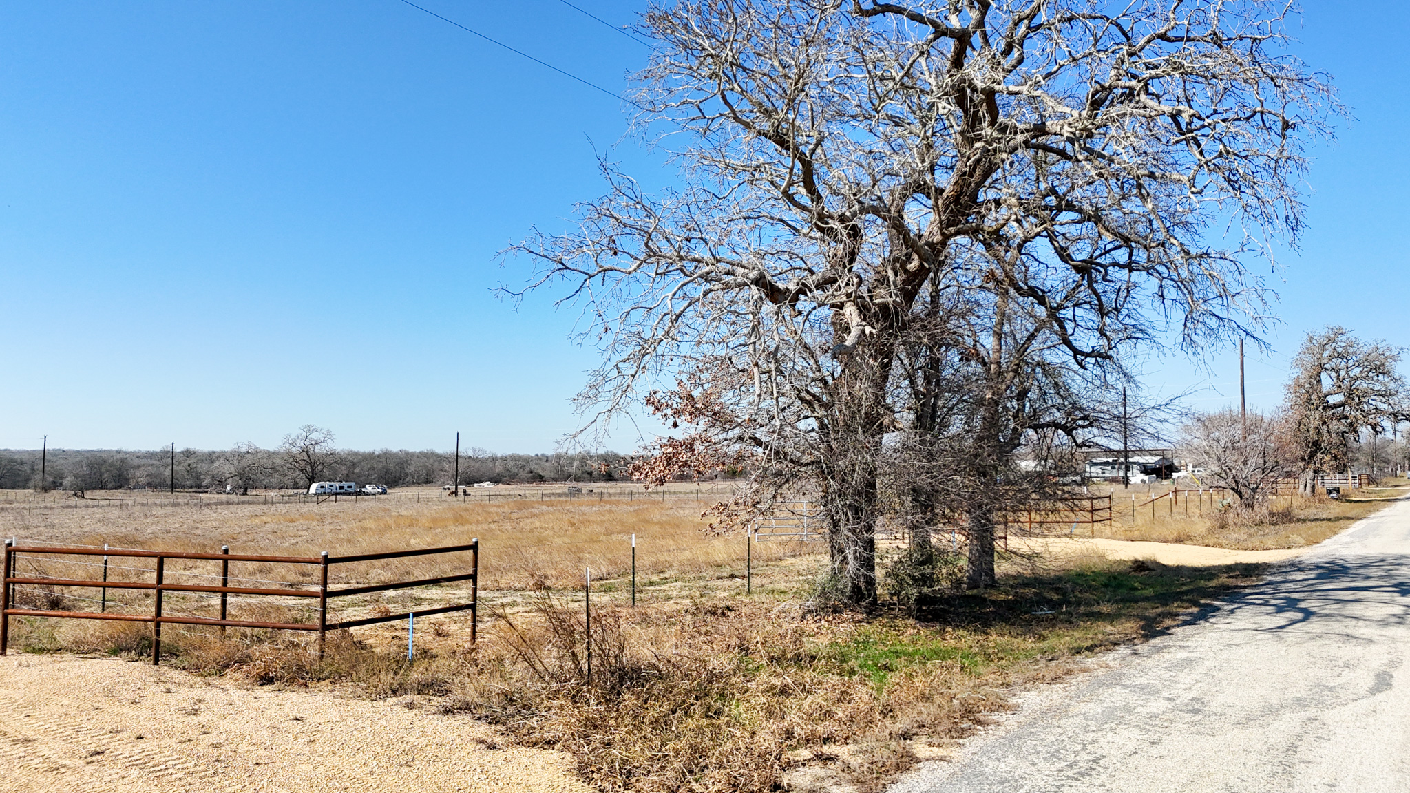 8200 Old Colony Line Road Dale, TX 78616 - Photo 3 of 9 a view of a yard with wooden fence