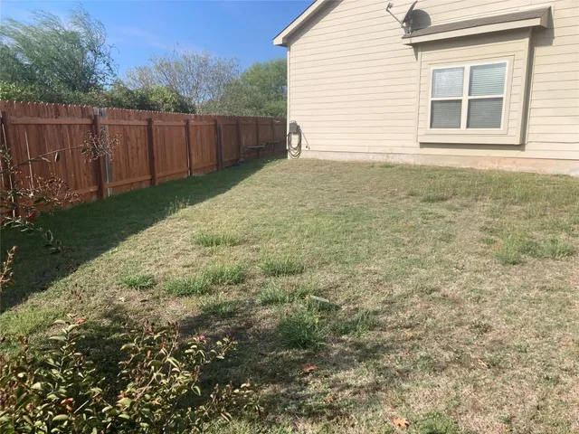 a view of front door and yard
