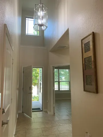 a kitchen with stainless steel appliances granite countertop a stove refrigerator and microwave