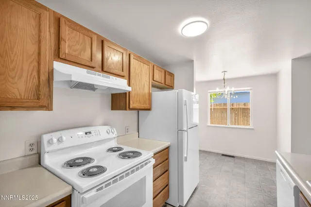 a kitchen with a sink and a window