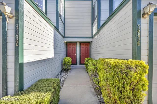 a view of two chairs in front of door