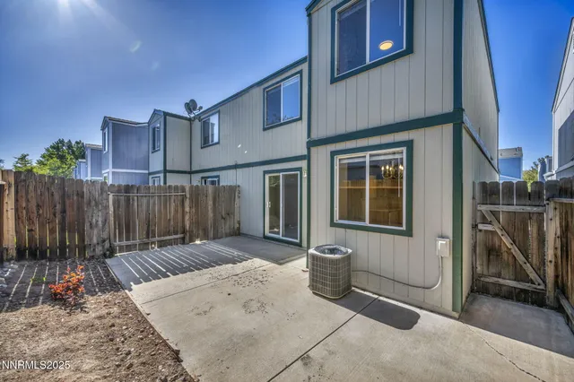 a view of a chair and table in the patio