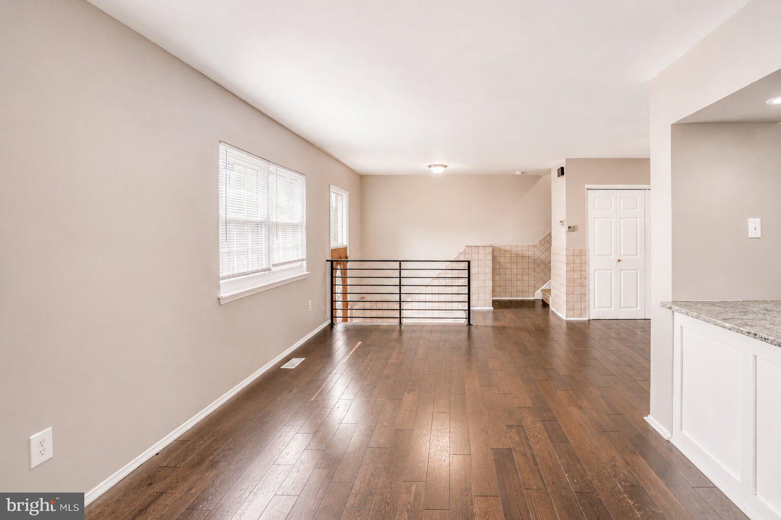 1723 Rachael Street, Unit B Philadelphia, PA 19115 - Photo 6 of 22 a view of an empty room with wooden floor and a window