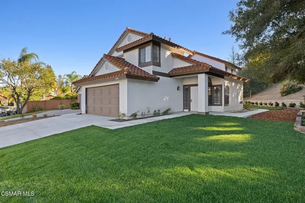 a view of a back yard of the house