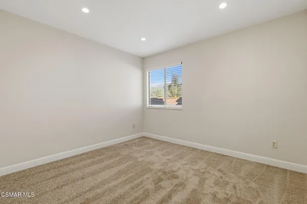 an empty room with a empty space and window