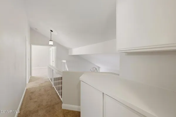 a view of a hallway with staircase