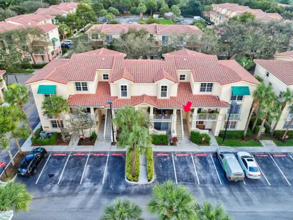 an aerial view of a house with garden space and street view