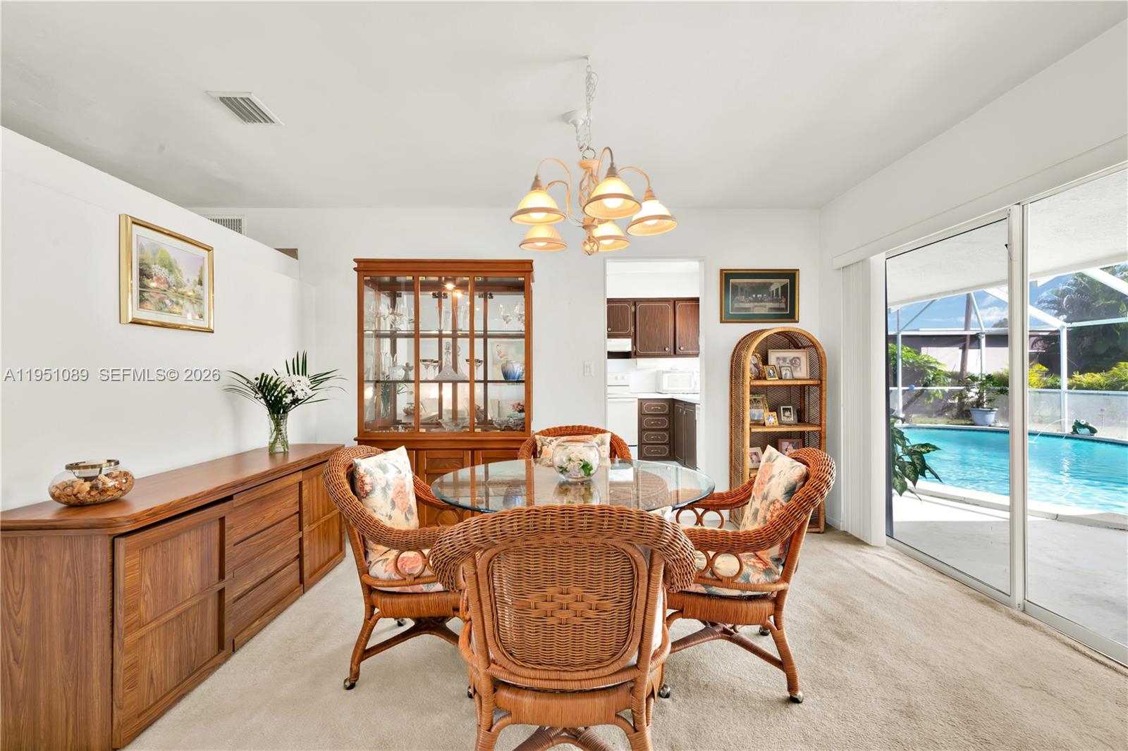 11260 Southwest 181st Terrace Miami, FL 33157 - Photo 16 of 57 a dining room with furniture and window