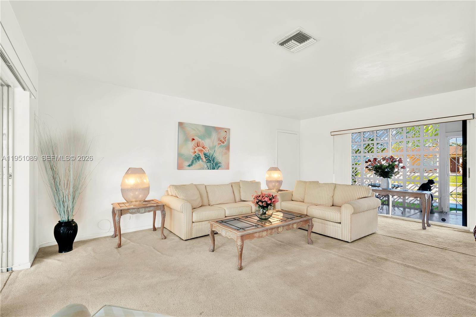 11260 Southwest 181st Terrace Miami, FL 33157 - Photo 18 of 57 a living room with furniture and a potted plant
