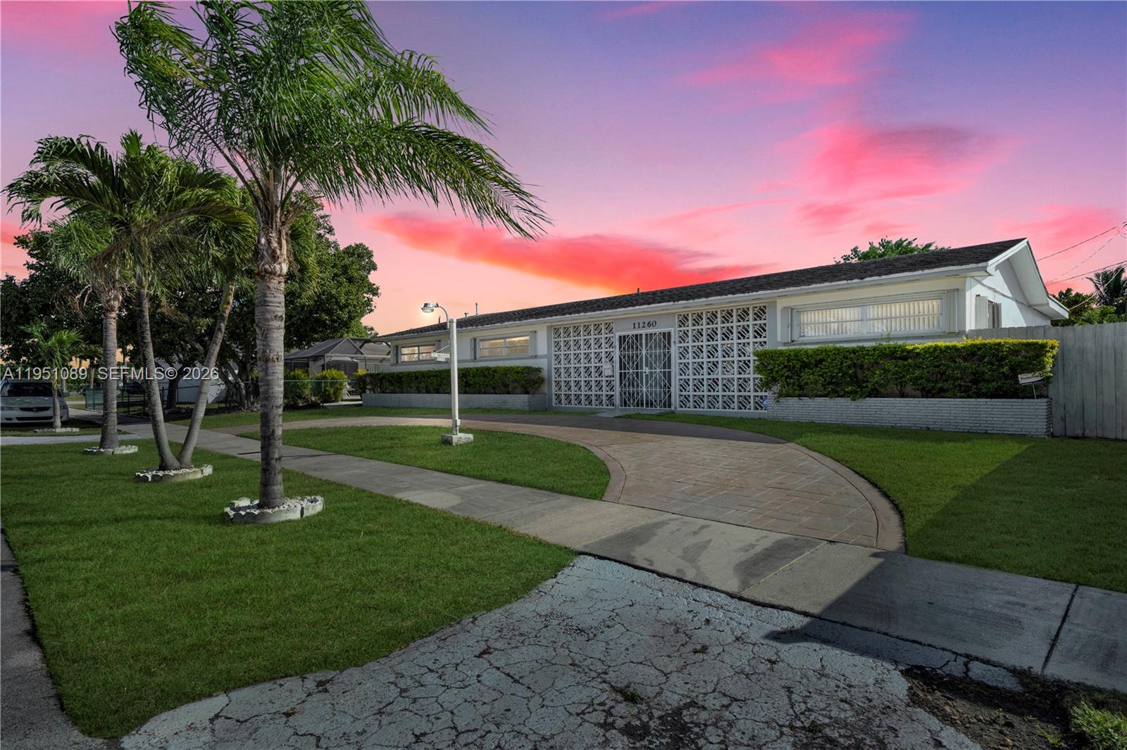 11260 Southwest 181st Terrace Miami, FL 33157 - Photo 3 of 57 a view of a house with a yard