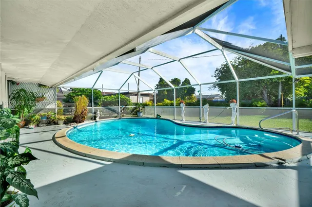 a view of yard with a swimming pool