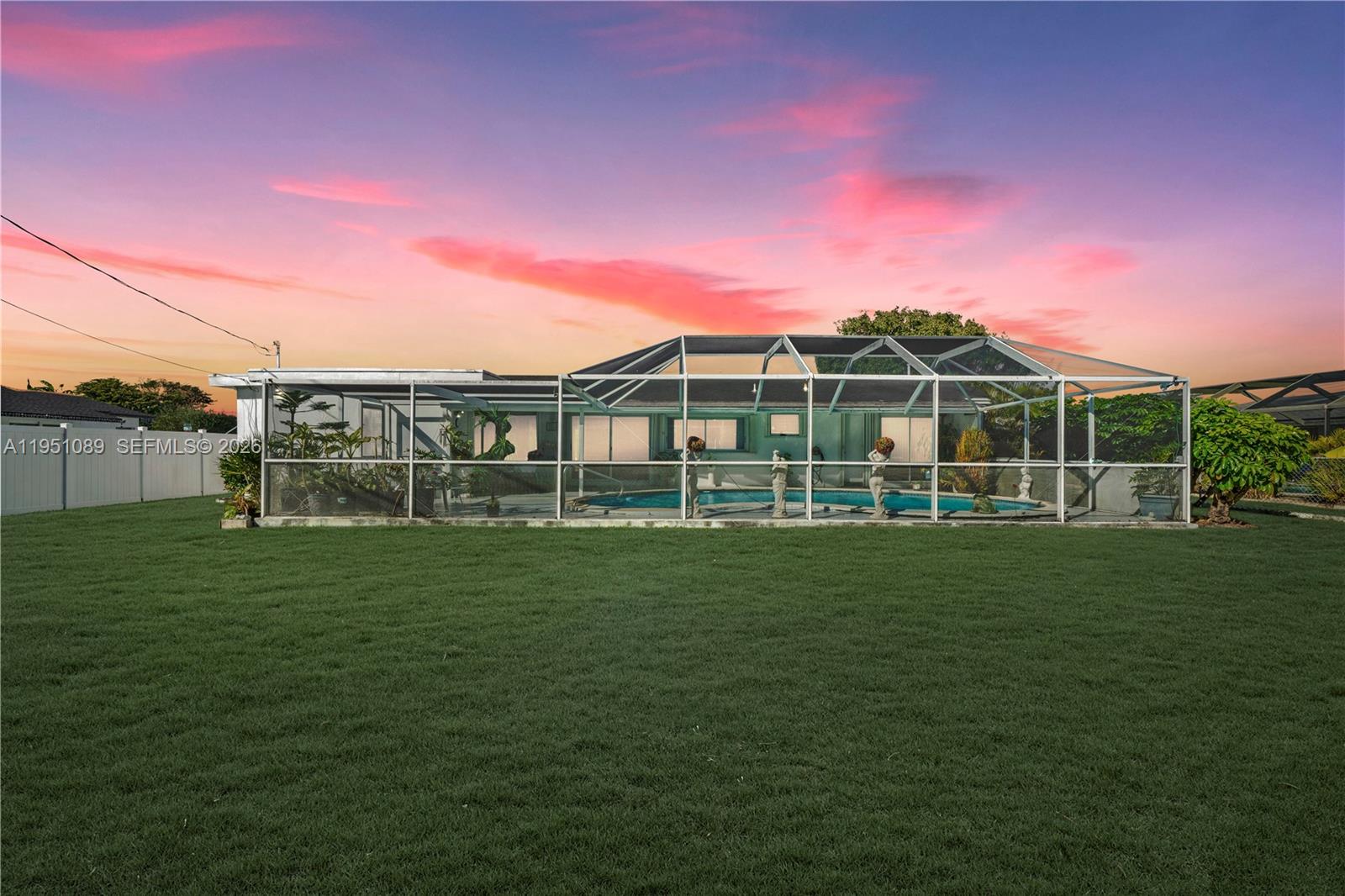 11260 Southwest 181st Terrace Miami, FL 33157 - Photo 4 of 57 a view of a house with a backyard