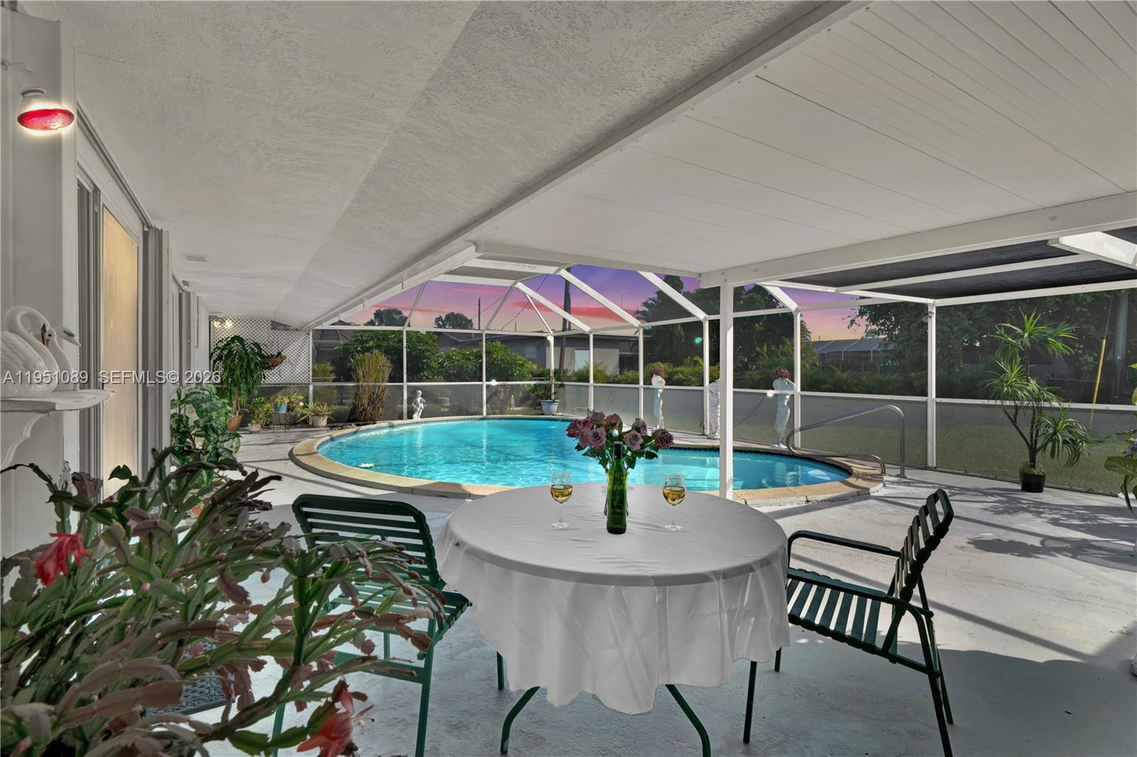 11260 Southwest 181st Terrace Miami, FL 33157 - Photo 42 of 57 a view of a patio with a table and chairs