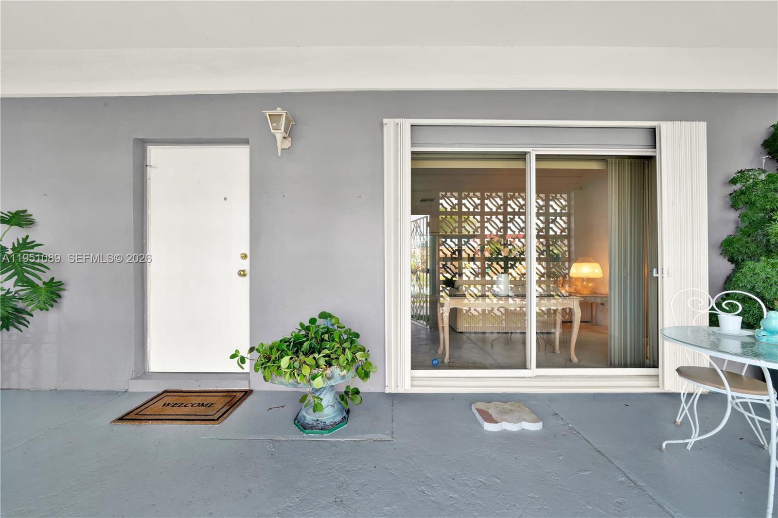 11260 Southwest 181st Terrace Miami, FL 33157 - Photo 46 of 57 a window and red door in front of a house