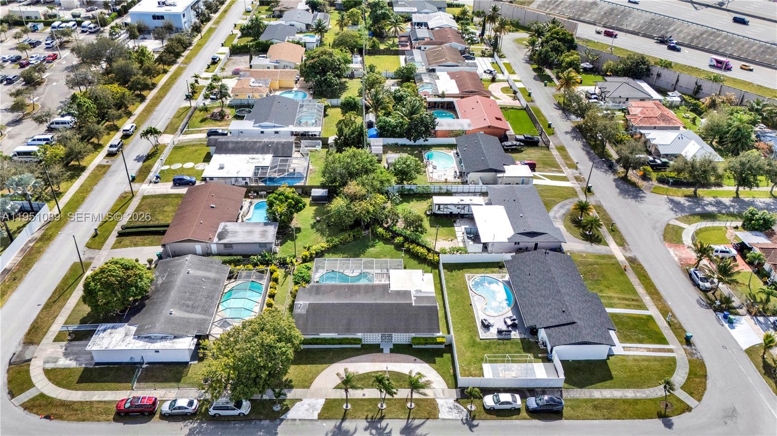 11260 Southwest 181st Terrace Miami, FL 33157 - Photo 50 of 57 an aerial view of residential houses and car parked