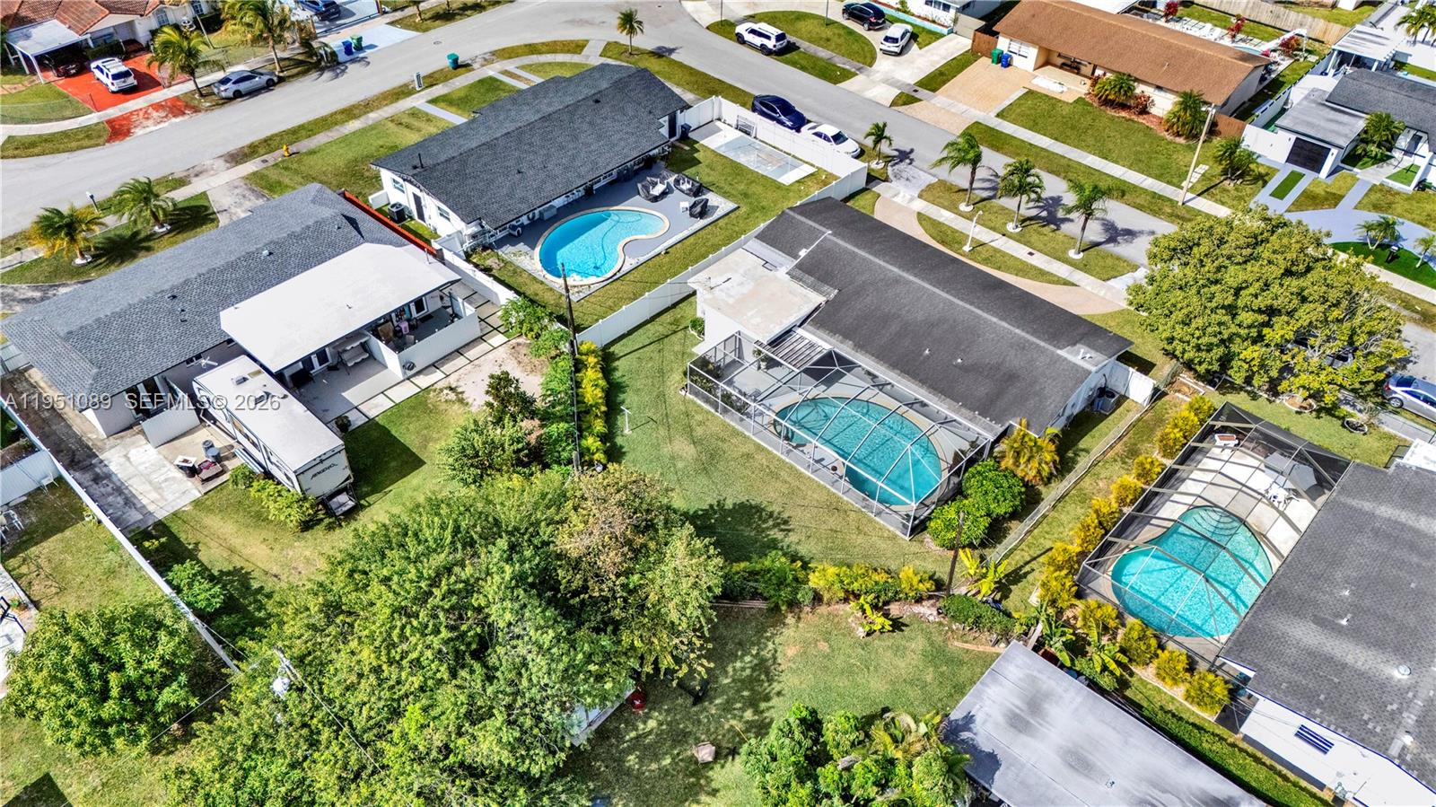 11260 Southwest 181st Terrace Miami, FL 33157 - Photo 53 of 57 an aerial view of a residential apartment building with a yard