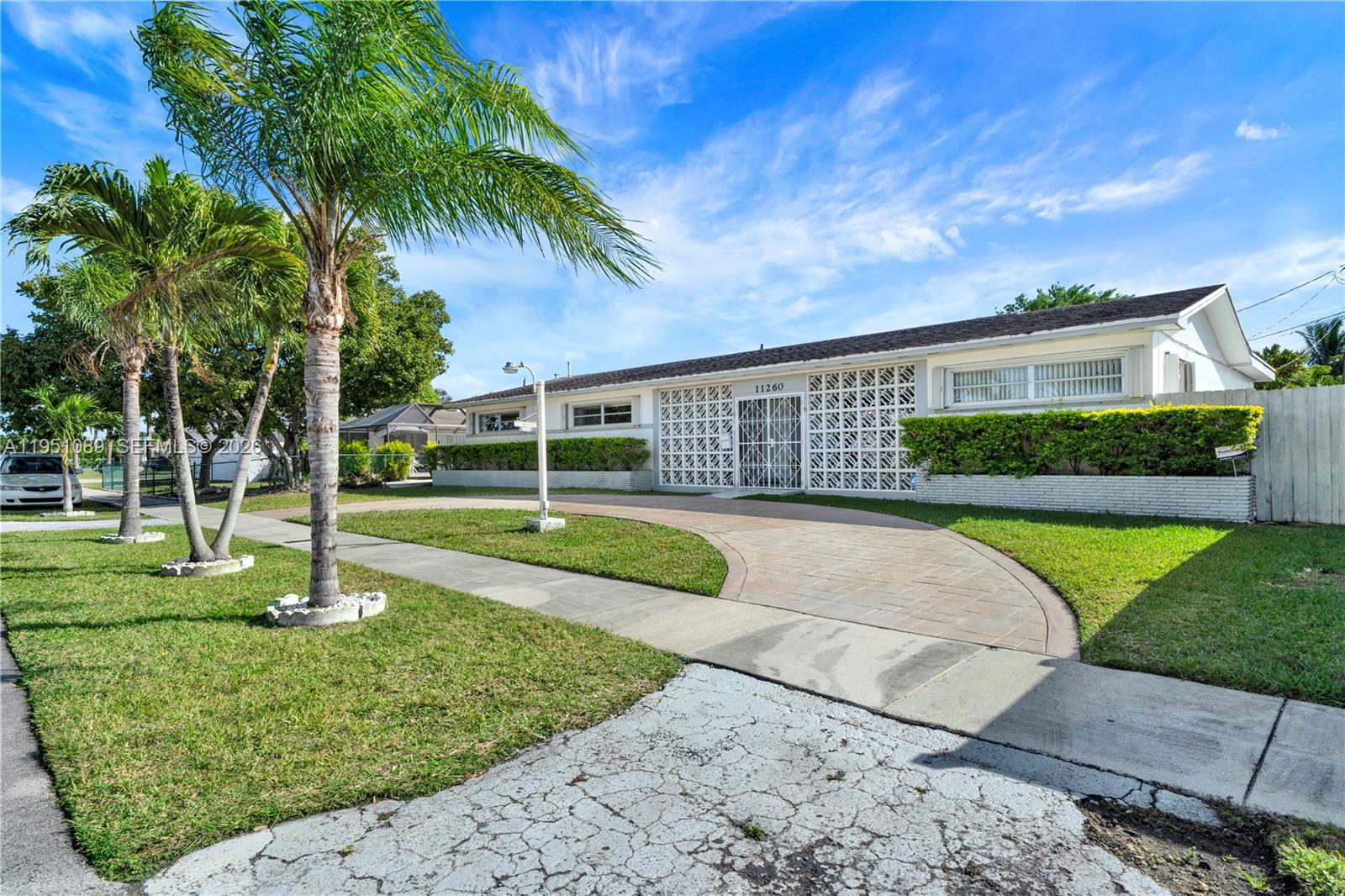 11260 Southwest 181st Terrace Miami, FL 33157 - Photo 57 of 57 a view of a house with a swimming pool and a yard