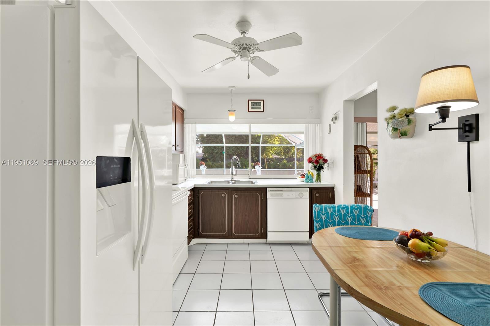 11260 Southwest 181st Terrace Miami, FL 33157 - Photo 8 of 57 a kitchen with stainless steel appliances granite countertop a sink and a refrigerator
