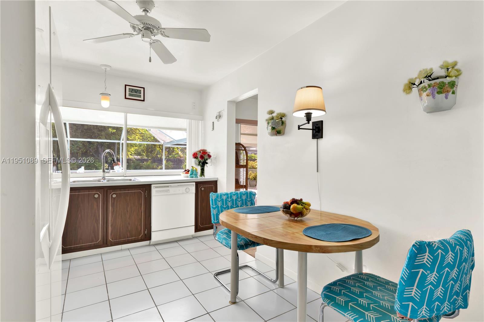 11260 Southwest 181st Terrace Miami, FL 33157 - Photo 10 of 57 a kitchen with a table and chairs