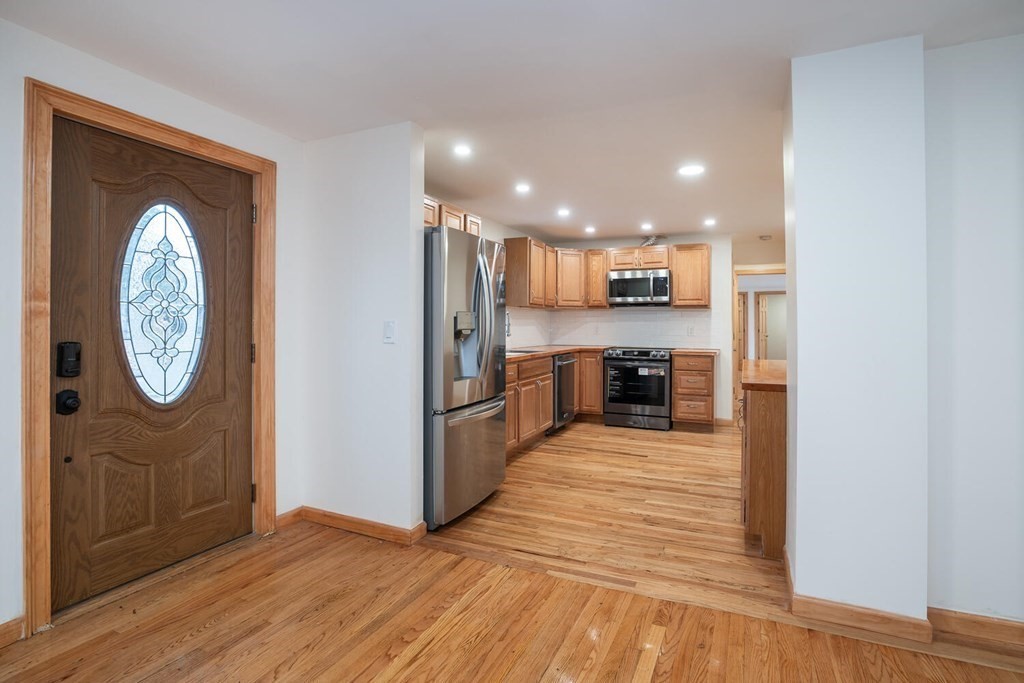 70 Leverett Road Amherst, MA 01002 - Photo 6 of 42 a view of a kitchen with a sink and a refrigerator