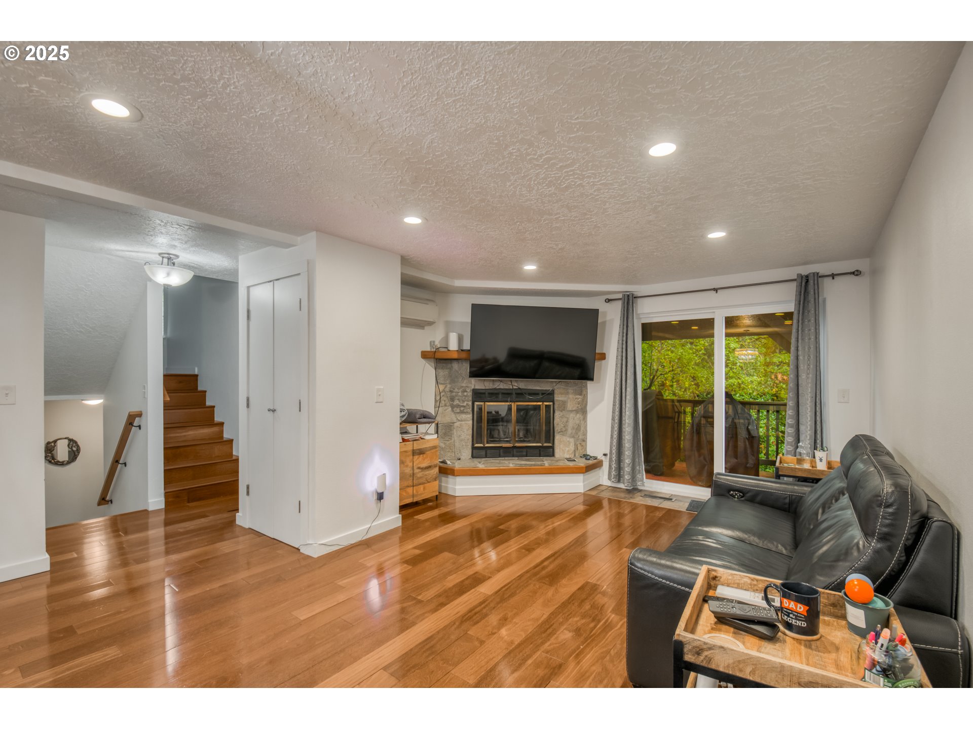 6196 Southwest Capitol Highway Portland, OR 97239 - Photo 2 of 18 a room with furniture and a flat screen tv