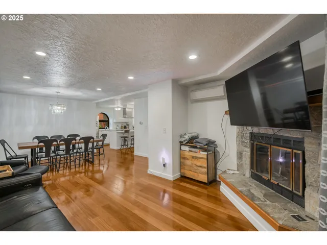 a living room with fireplace furniture and a flat screen tv