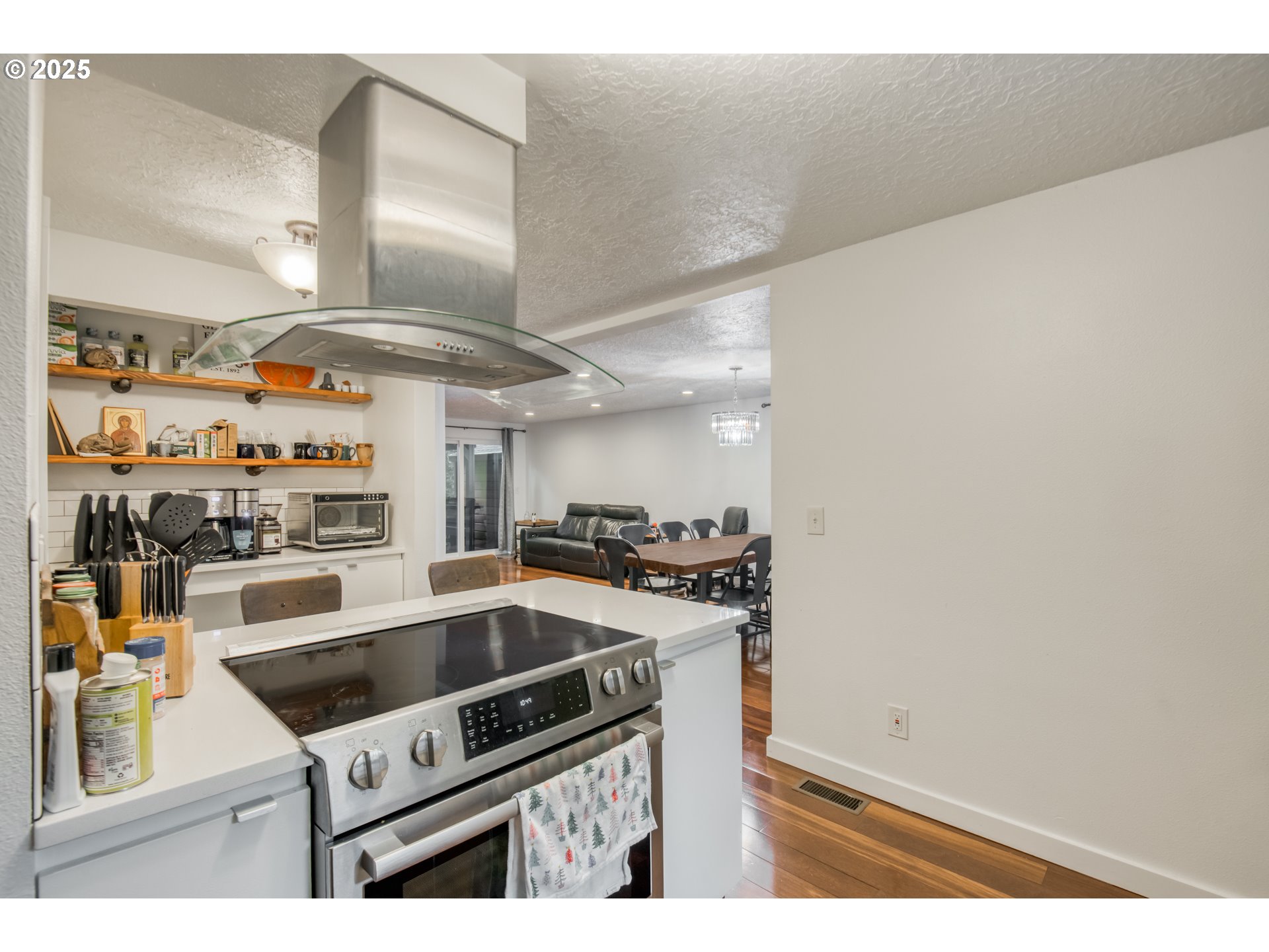 6196 Southwest Capitol Highway Portland, OR 97239 - Photo 9 of 18 a kitchen with a stove and a microwave