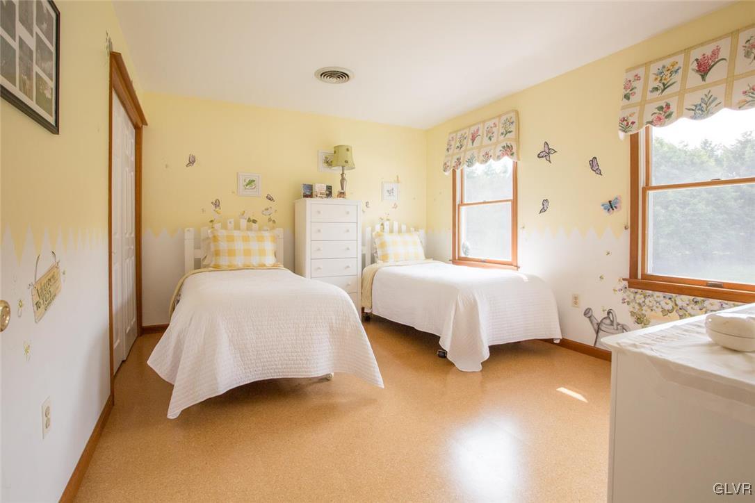 1552 Bushkill Center Road Bath, PA 18014 - Photo 19 of 32 a bedroom with a bed and wooden floor