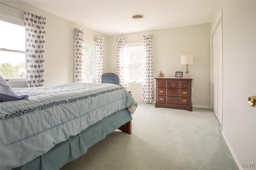 1552 Bushkill Center Road Bath, PA 18014 - Photo 20 of 32 a bedroom with a bed and a cabinets