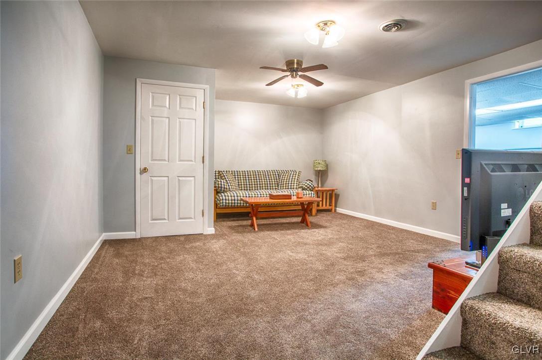 1552 Bushkill Center Road Bath, PA 18014 - Photo 23 of 32 a living room with furniture and a chandelier