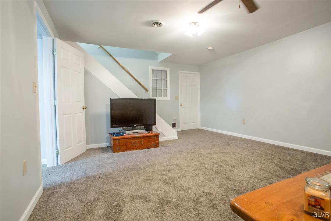1552 Bushkill Center Road Bath, PA 18014 - Photo 25 of 32 a view of a livingroom with furniture and a flat screen tv
