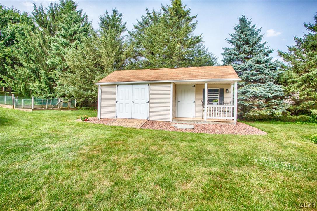 1552 Bushkill Center Road Bath, PA 18014 - Photo 29 of 32 a front view of house with yard and trees in the background