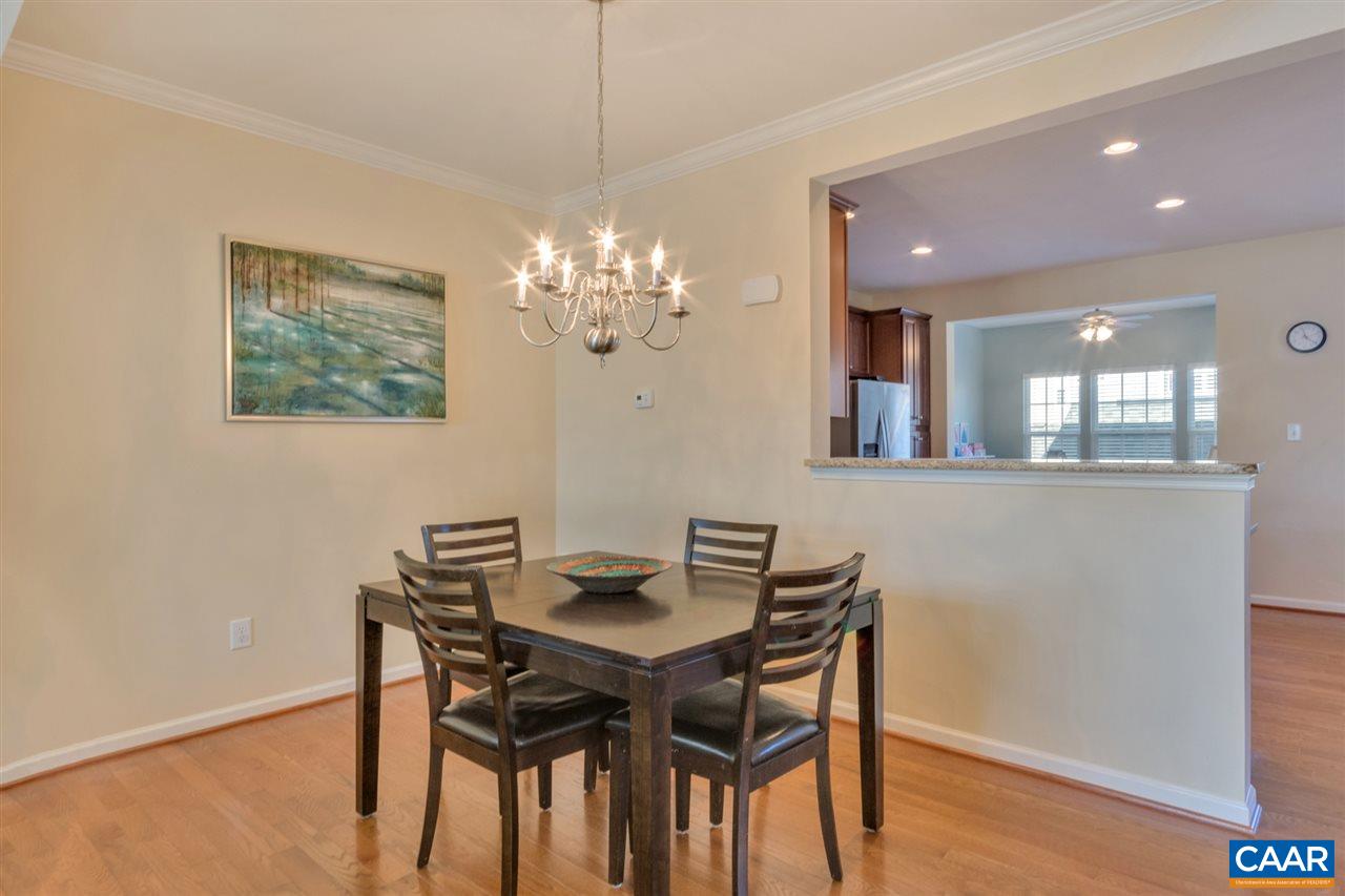 735 Rainier Road Charlottesville, VA 22903 - Photo 12 of 30 a view of a dining room with furniture and chandelier