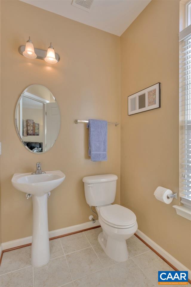 735 Rainier Road Charlottesville, VA 22903 - Photo 20 of 30 a bathroom with a toilet sink and mirror