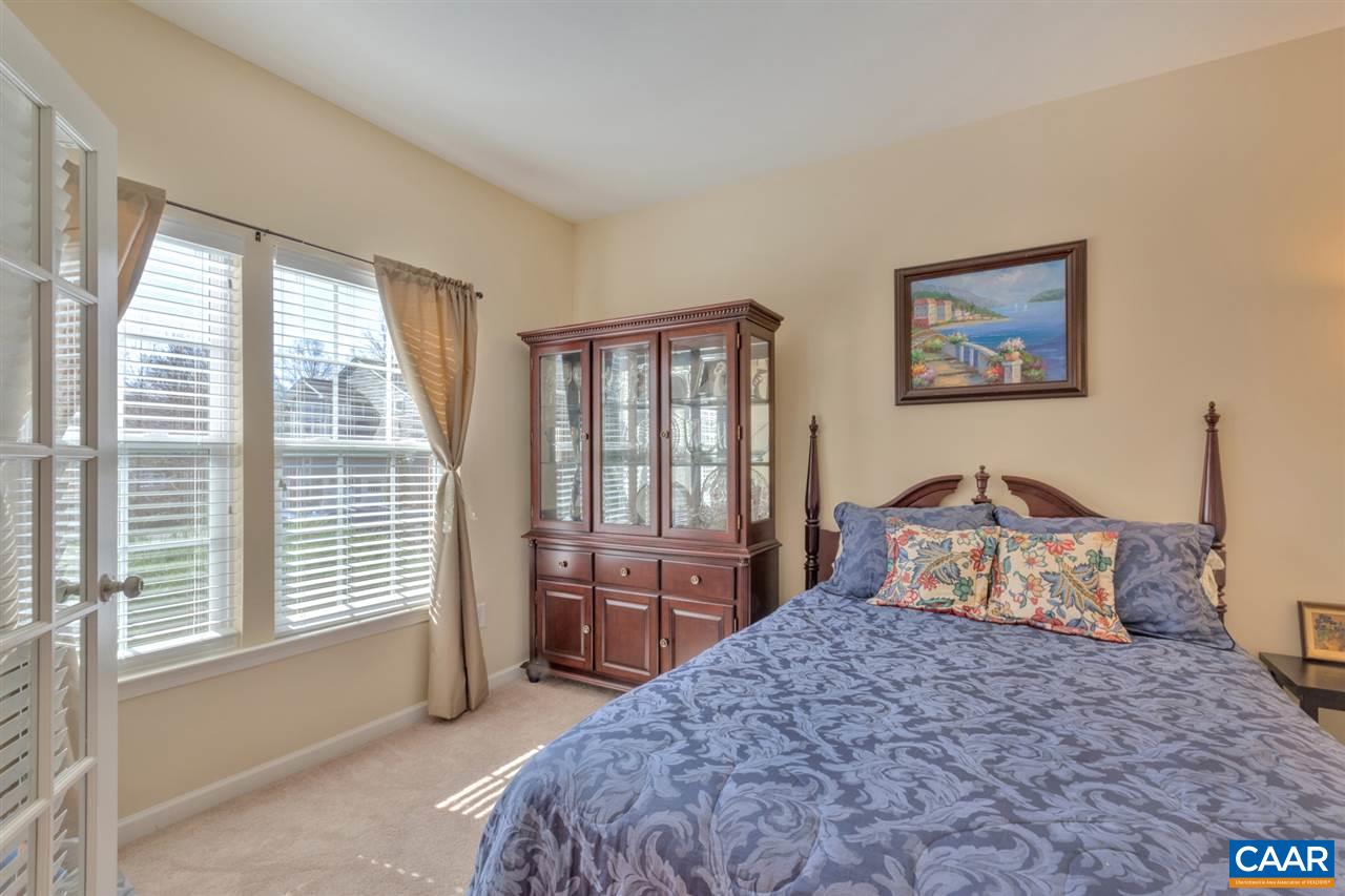 735 Rainier Road Charlottesville, VA 22903 - Photo 4 of 30 a bedroom with a large bed and a window