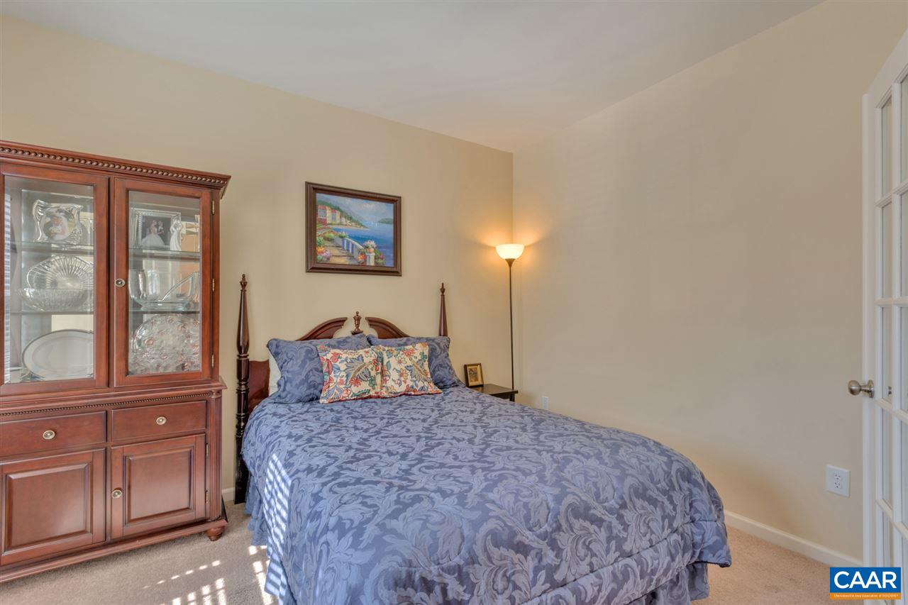 735 Rainier Road Charlottesville, VA 22903 - Photo 5 of 30 a bedroom with a large bed and wooden floor