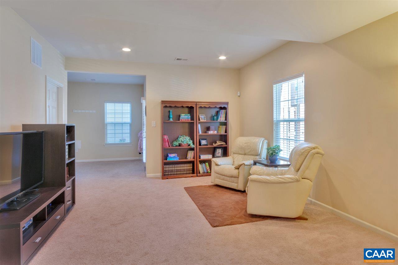 735 Rainier Road Charlottesville, VA 22903 - Photo 6 of 30 a living room with furniture and a flat screen tv